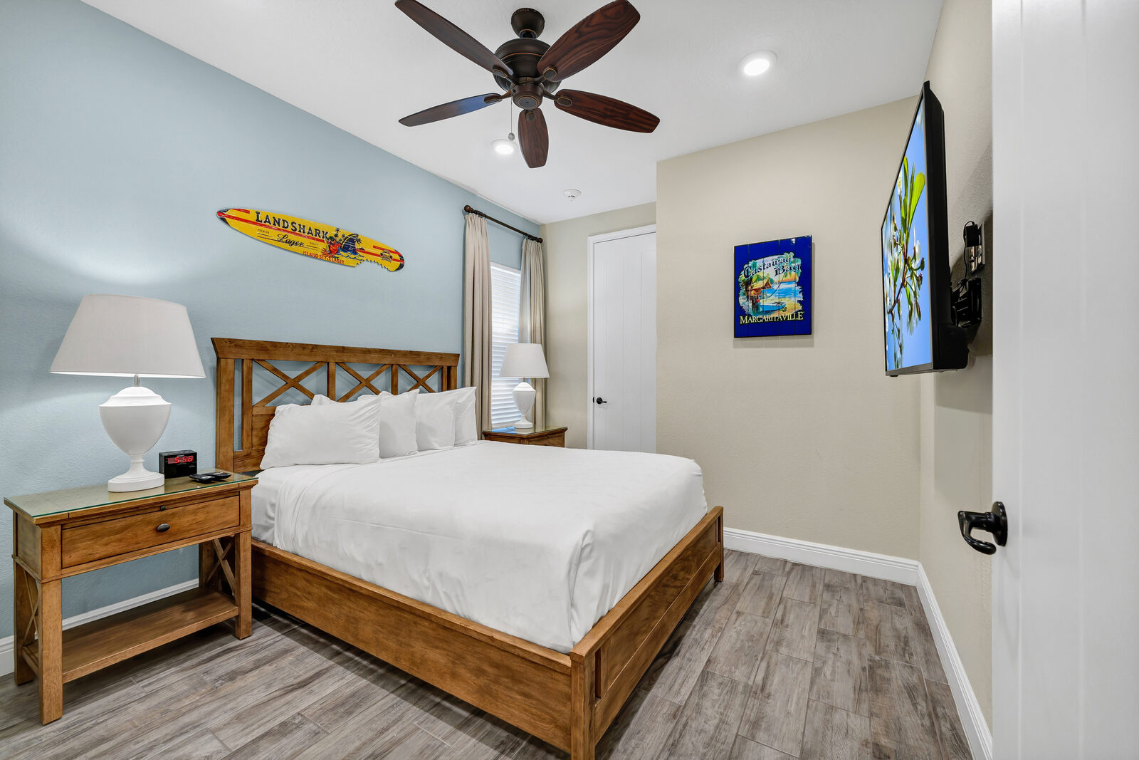 Queen bedroom with a wood bed frame