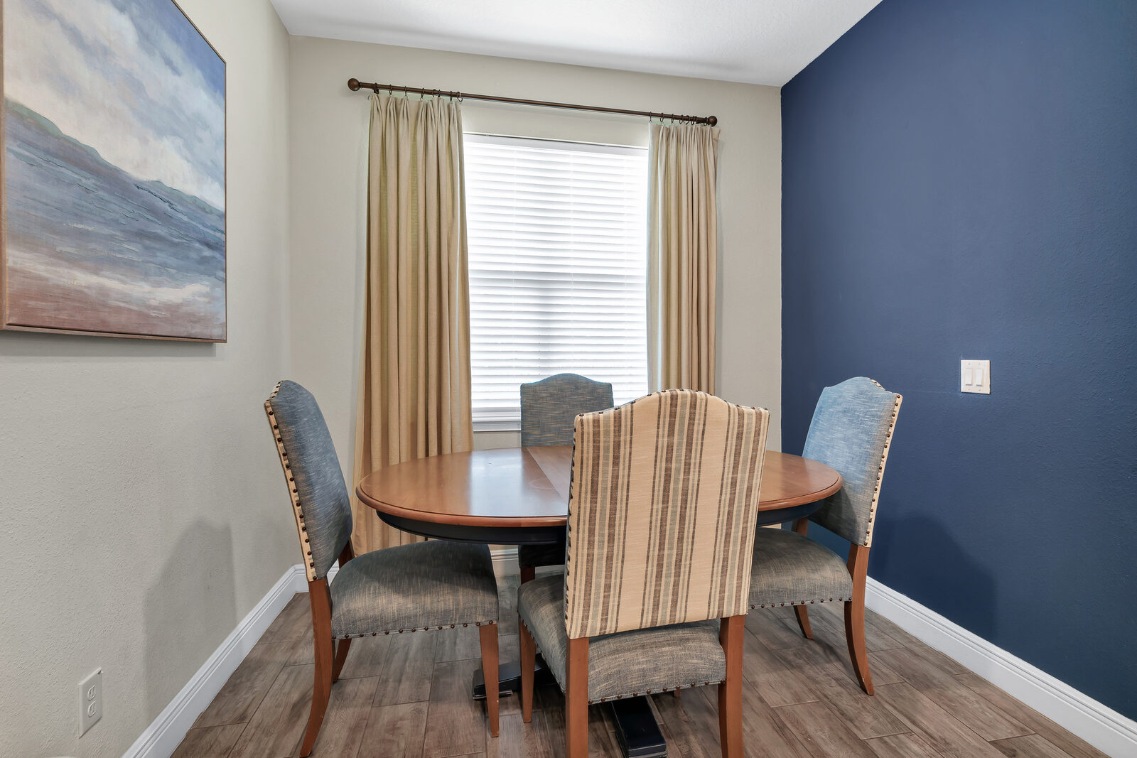 Dining table against a navy wall