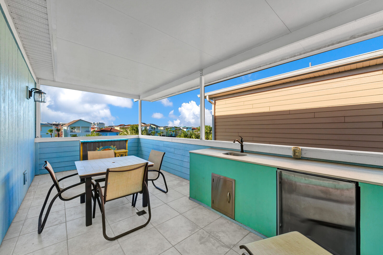 Rooftop terrace wet bar with fridge and counter