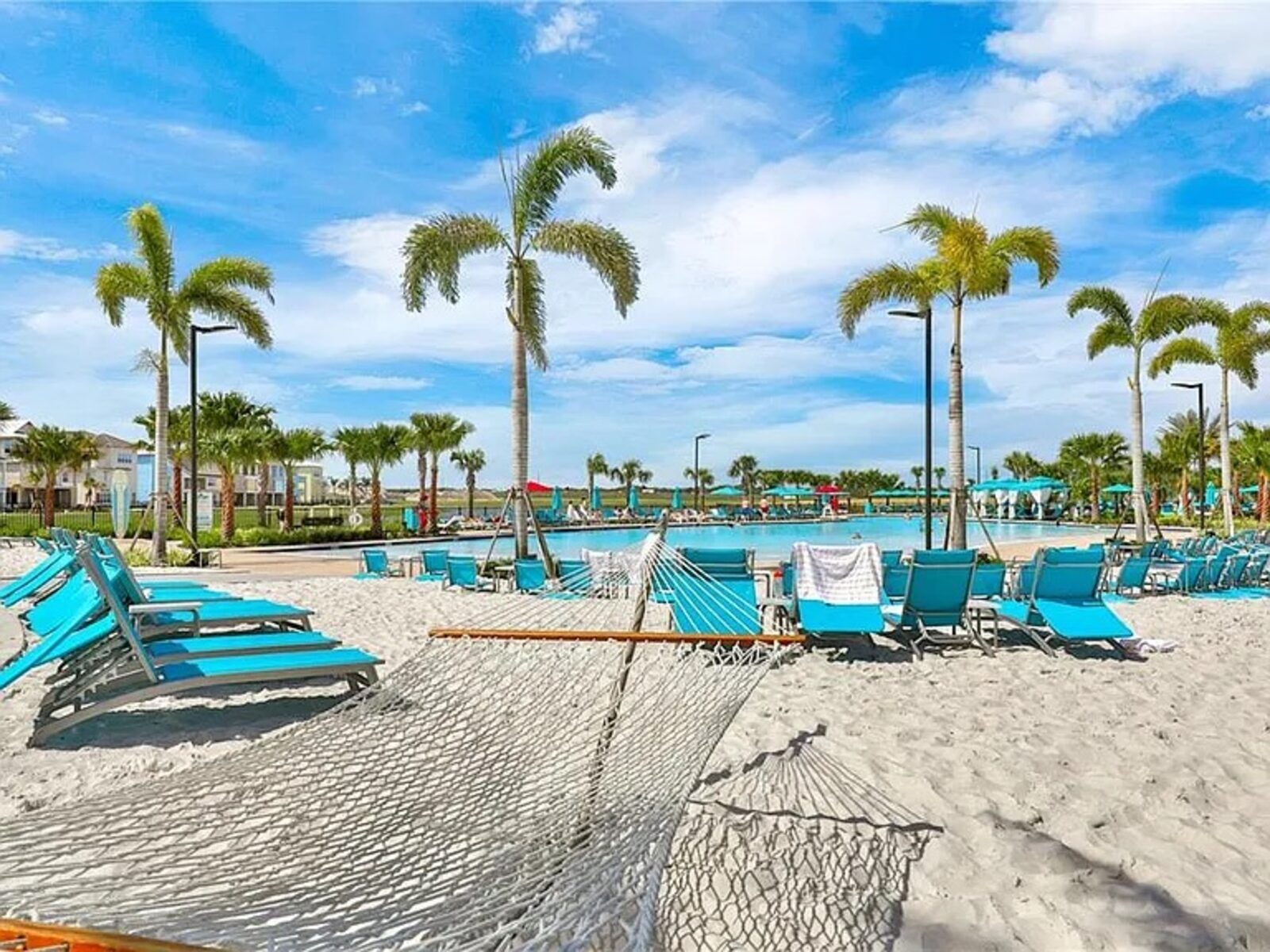 Sand beach at the resort with loungers and a hammock