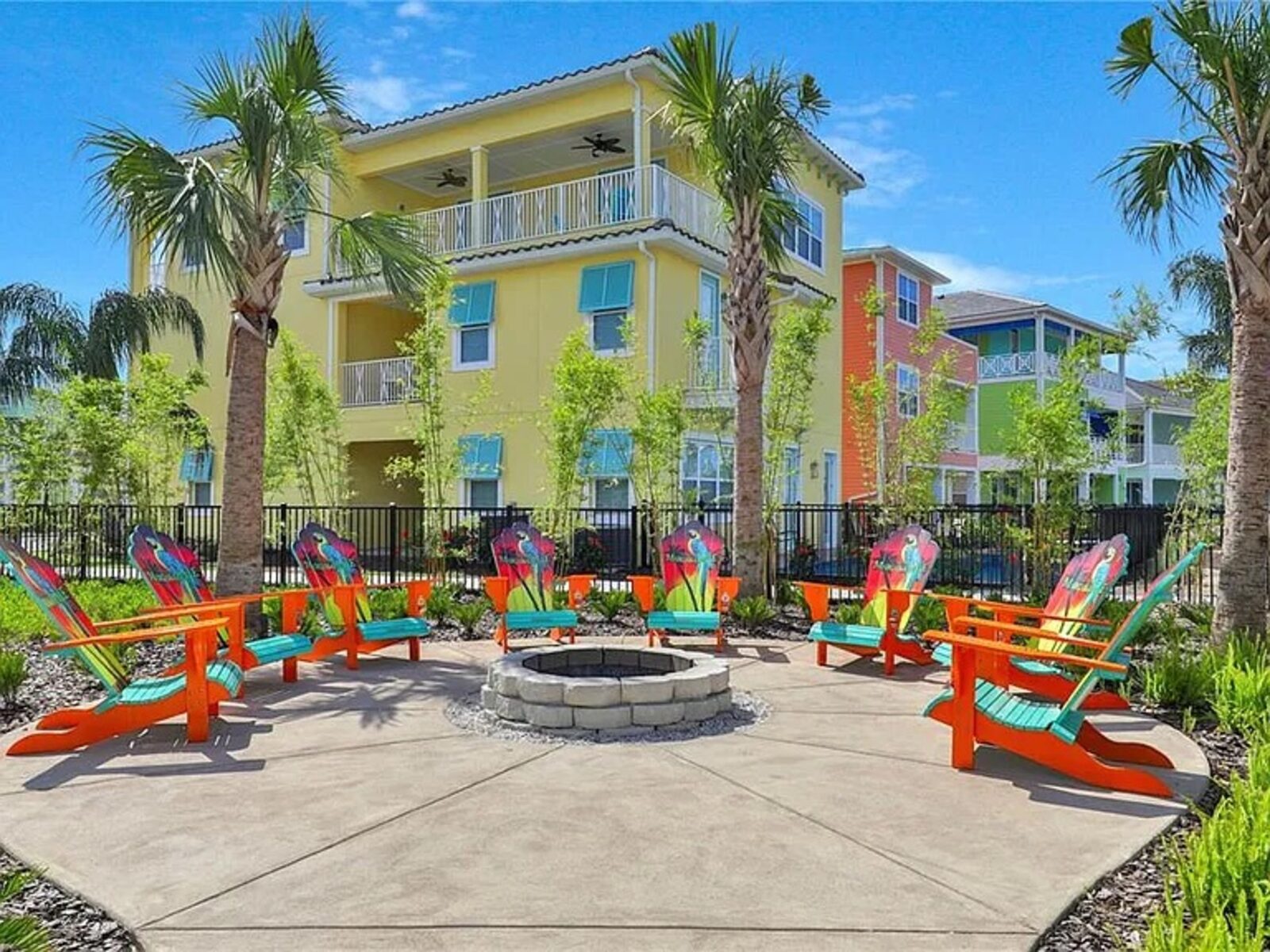 Fire pit with colorful chairs at the resort