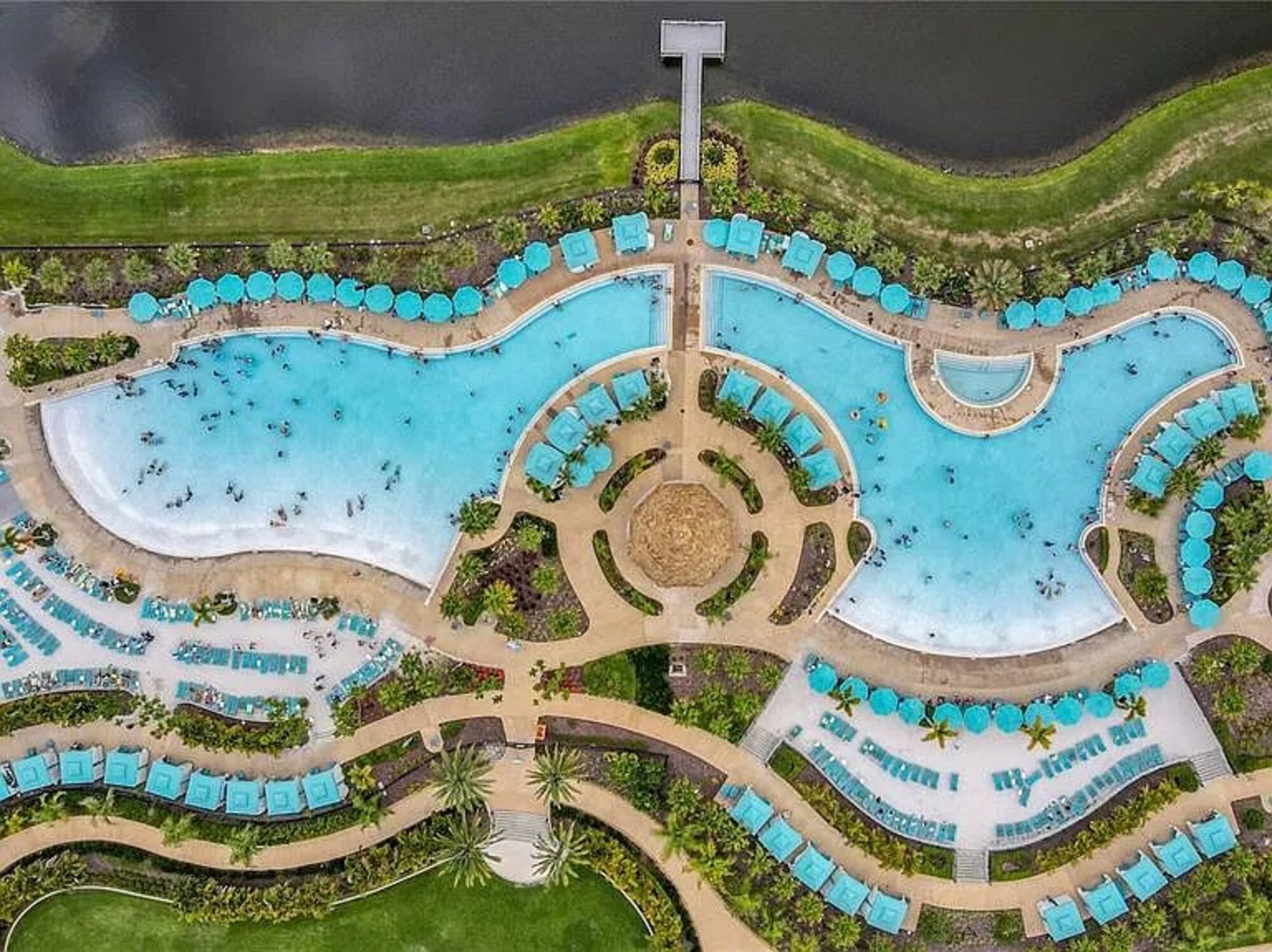 Aerial view of the resort's lagoon pool and sand beach
